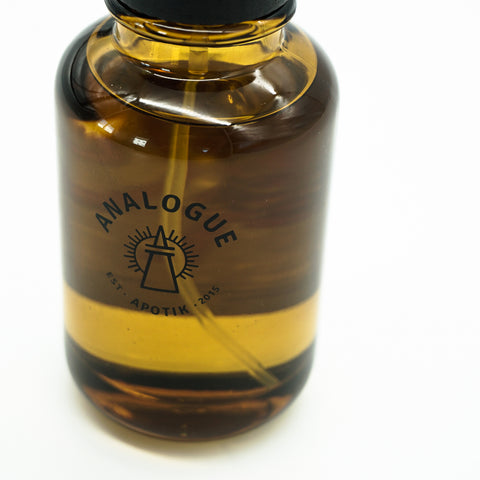 Bottle of Conquestor Oil de Parfum, warm and woody aroma showing nalogue Apotik brand