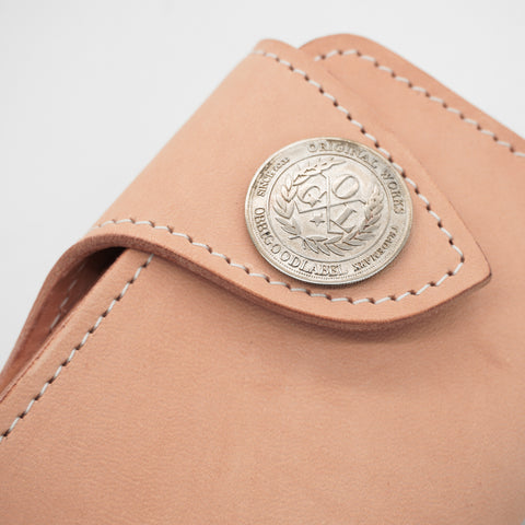 Rugged full-grain horsehide wallet with brass concho snap