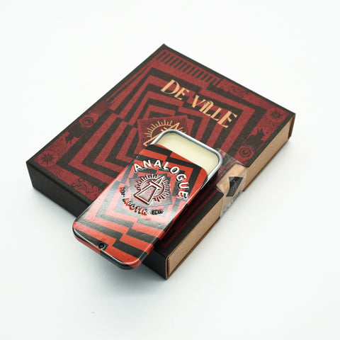 Compact tin of Deville Solid Cologne with cherry and leather notes, crafted for Singapore & Worldwide.