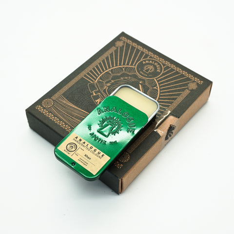 Compact tin of Khan Solid Cologne with citrus, spice and sandalwood, handcrafted for Singapore & Worldwide.