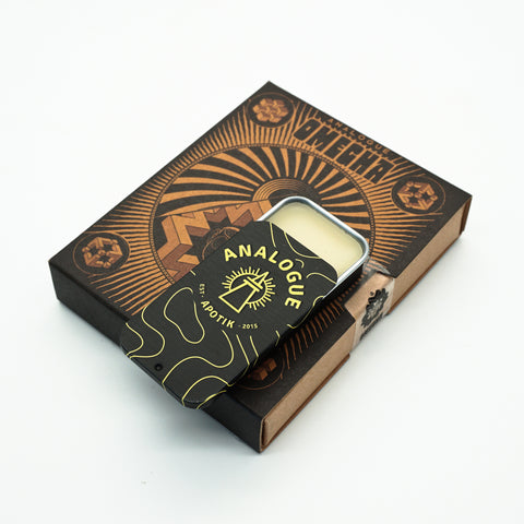 Compact tin of Omegha Solid Cologne with fresh pineapple and oakmoss, available in Singapore & SE Asia.