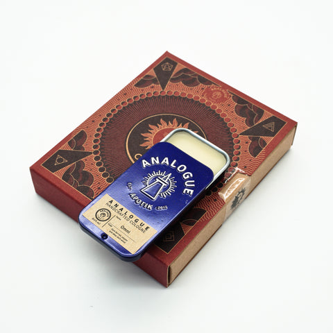 Compact tin of Omni Solid Cologne with leather and dark berry notes, crafted for Singapore & SE Asia.