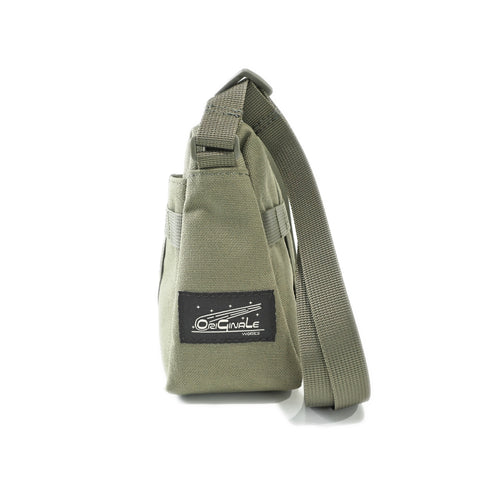 OriGinaLe Origo Sling bag showing OriGinaLe woven logo label