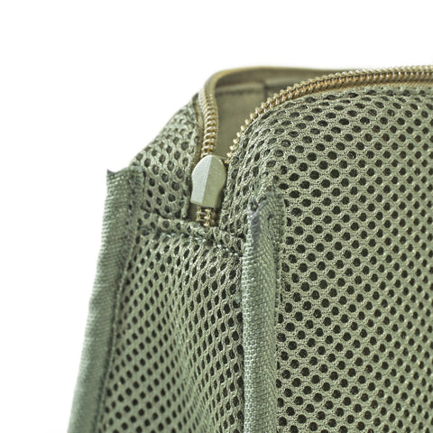 Close-up of breathable mesh pocket and Signature Cushion-Padded Lining inside OriGinaLe Origo Sling Bag