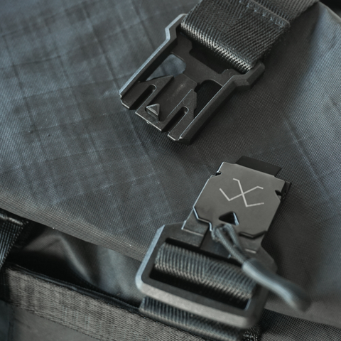 Black roll-top tote bag made from ECOPAK sailcloth with Fidlock magnetic closure by Obbi Good Label