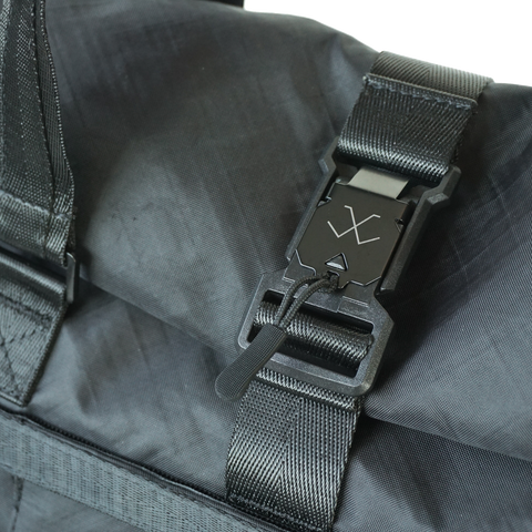 Black roll-top tote bag made from ECOPAK sailcloth with Fidlock magnetic closure by Obbi Good Label