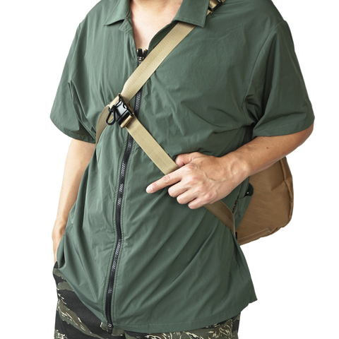 model using body-secure strap on obbi good label OriGinaLe XTAC Hobo Bag in Gold