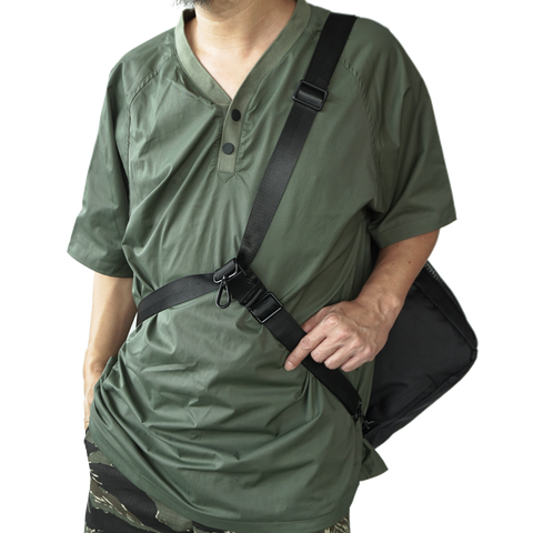 model using body-secure strap for obbi good label OriGinaLe XTAC Tote Bag in Black