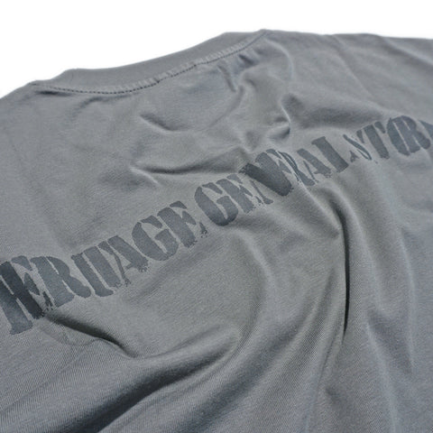 Close-up tonal Heritage General Store stencil back print on grey cotton T-shirt