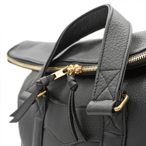 Reinforced leather handles with premium hardware on handmade leather briefcase