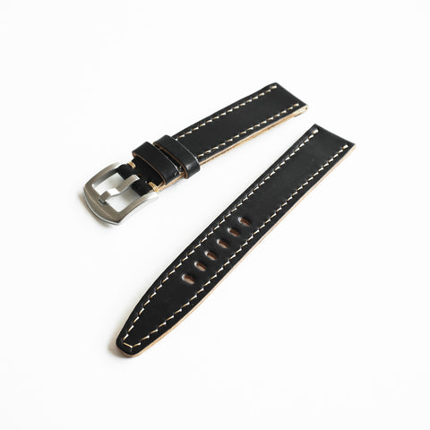 Hand saddle stitched Horween Shell Cordovan watch strap showing traditional leather craftsmanship