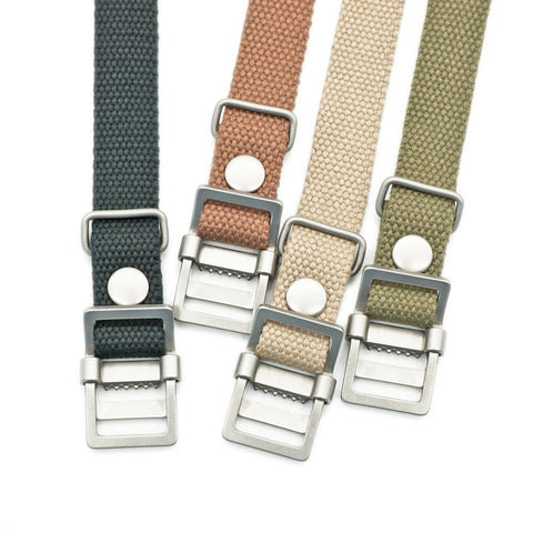 OGL WTC Utility Canvas Strap in cotton duck canvas showing all available colours (black, olive, beige, natural) with brushed metal hardware close-up for mechanical watches and everyday wear