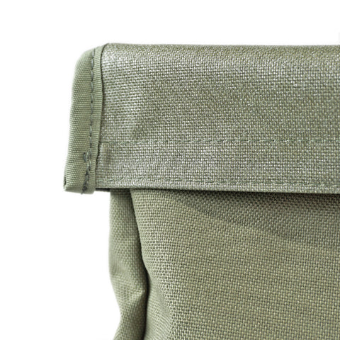 Showing close-up of expandable roll-top closure detail on the OriGinaLe Origo technical canvas hobo bag