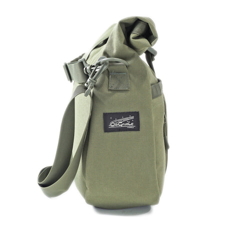 Side profile of the OriGinaLe Origo Roll-Top Hobo Bag showing OriGinaLe Works logo