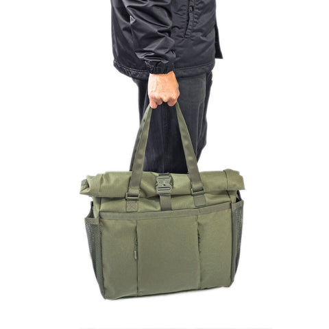Model hand carry OriGinaLe Origo Roll-Top Tote Bag in olive technical canvas in Rugged Gentlemen Shoppe Singapore