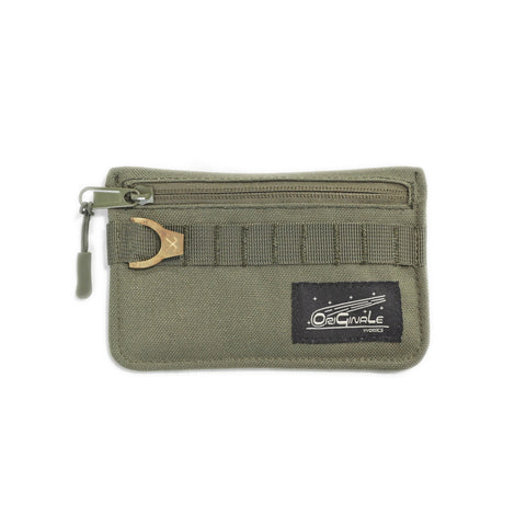 ORIGO Utility Wallet in olive abrasion-resistant technical canvas with brass horseshoe detail and zippered compartment by Obbi Good Label.
