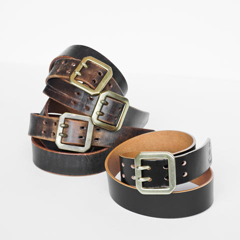 Showing aged and tea-core effect of OGL Double-Prong Garrison Belt Hand-Dyed Black handmade full-grain leather solid brass double-prong buckle