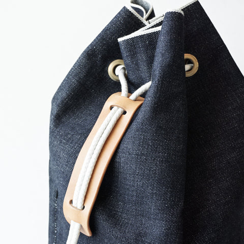 FAITH SFK LEATHER DENIM BUCKET BAG INDIGO