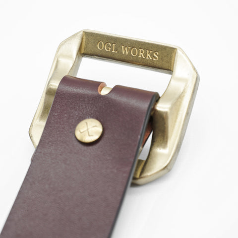 OGL Single-Prong Garrison Leather Belt Full-Dyed Tan showing OGL Works solid brass buckle, Timeless Style