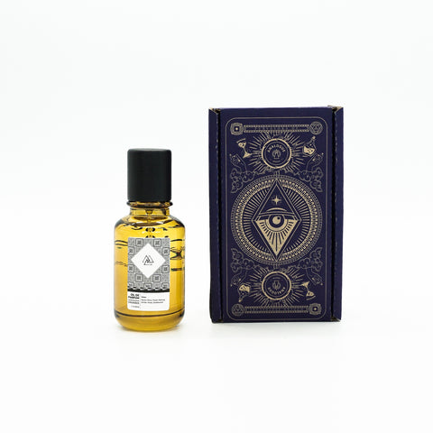 Bottle of Colossus Oil de Parfum with citrus and spice notes