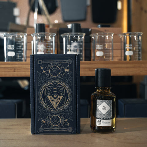 Bottle of Colossus Oil de Parfum with citrus and spice notes