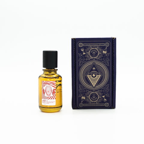 Bottle of Conquestor Oil de Parfum, warm and woody aroma