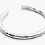 OGL OBBI GOOD LUCK HAND-HAMMERED SILVER BANGLE