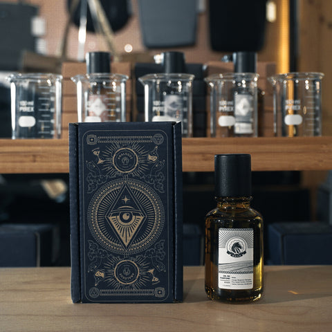 Bottle of Khan Oil de Parfum featuring citrus, amber and sandalwood, available in Singapore & Worldwide.