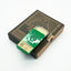 Compact tin of Khan Solid Cologne with citrus, spice and sandalwood, handcrafted for Singapore & Worldwide.