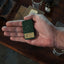 Compact tin of Khan Solid Cologne with citrus, spice and sandalwood, handcrafted for Singapore & Worldwide.