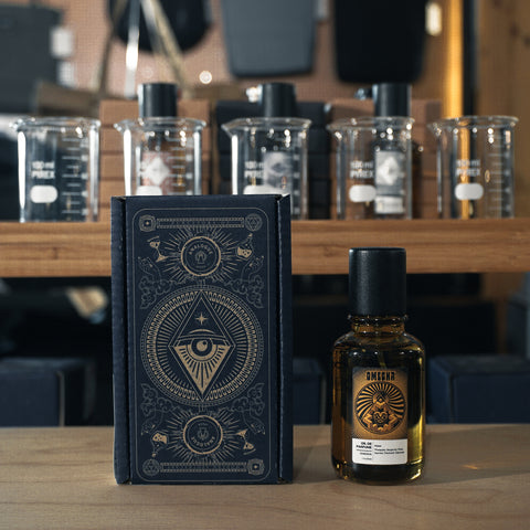 Bottle of Omegha Oil de Parfum with pineapple, bergamot and oakmoss, available in Singapore & SE Asia.