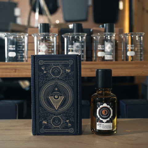 Bottle of Omni Oil de Parfum with leather, rose and dark berry notes, available in Singapore & SE Asia.