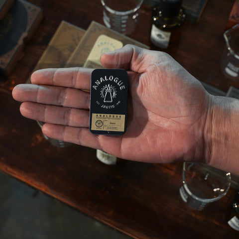 Compact tin of Omni Solid Cologne with leather and dark berry notes, crafted for Singapore & SE Asia.