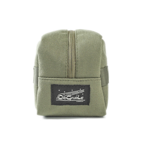 ORIGO Utility Dopp Kit in olive abrasion-resistant technical canvas side view showing OriGinaLe sewn-on label by Obbi Good Label.