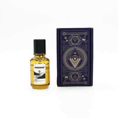 Bottle of Phenomen Oil de Parfum with sandalwood, oak and red berries, available in Singapore & SE Asia.