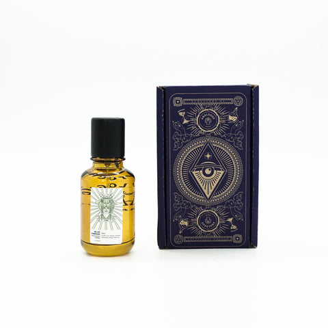 Bottle of Yama Oil de Parfum with rose and sakura floral notes, available in Singapore & SE Asia.