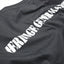 Close-up Heritage General Store stencil back print on black cotton T-shirt