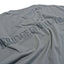 Close-up tonal Heritage General Store stencil back print on grey cotton T-shirt