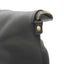 Fold-down leather briefcase opening designed to help protect contents from rain