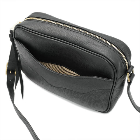 Front pocket detail on handmade full-grain leather handbag