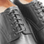 Close-up view of OGL BRAVE plain-toe Derby shoe showing construction and the waxed laces