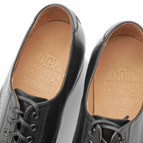 Natural leather OrthoLite insoles with embossed OGL branding inside premium horsehide Derby shoes