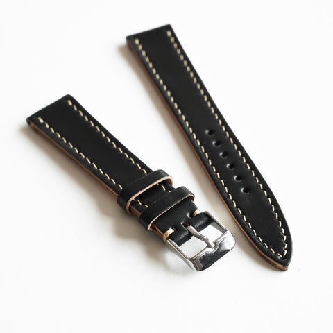 Hand saddle stitched Horween Shell Cordovan watch strap showing traditional leather craftsmanship