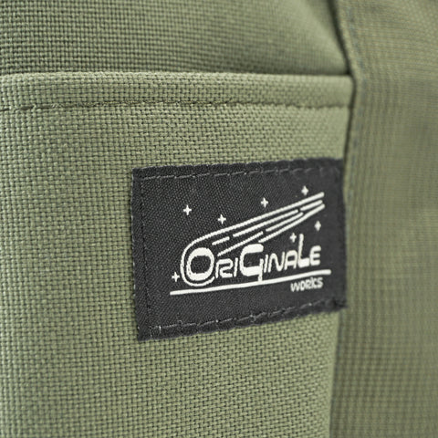 OriGinaLe Works logo patch on olive Boston duffle bag