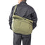 Model cross-body carry OriGinaLe Origo Roll-Top Hobo Bag with stabilizer system reducing movement while cycling and commuting in Rugged Gentlemen Shoppe Singapore