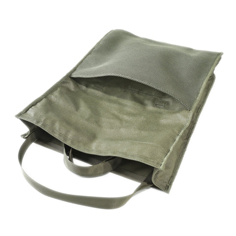 OriGinaLe Origo Roll-Top Tote Bag turning inside out showing signature cushion-padded interior and pocket compartment